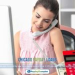 A woman sitting in front of a computer holding a phone and talking about Chicago payday loan options