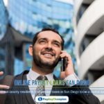 A man in a suit talking on a cell phone about online payday loans in San Diego