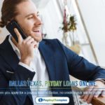 man in a black suit making a phone call inside a building
