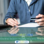 man signing for credit card