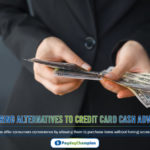 A man in a suit holding a stack of money exploring alternatives to credit card cash advances