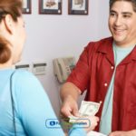 a person handing money to another person.