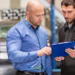 A couple of men standing next to each other understanding beginner’s guide about vehicle loans