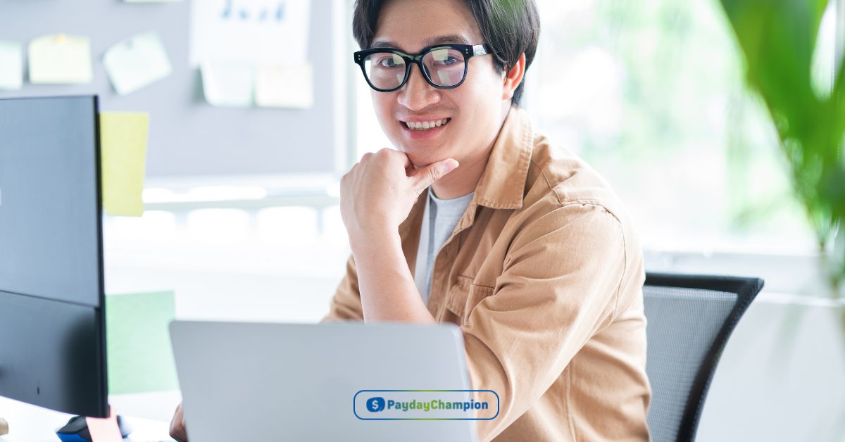 A person sitting at a desk with a laptop learning how Direct Plus loans work