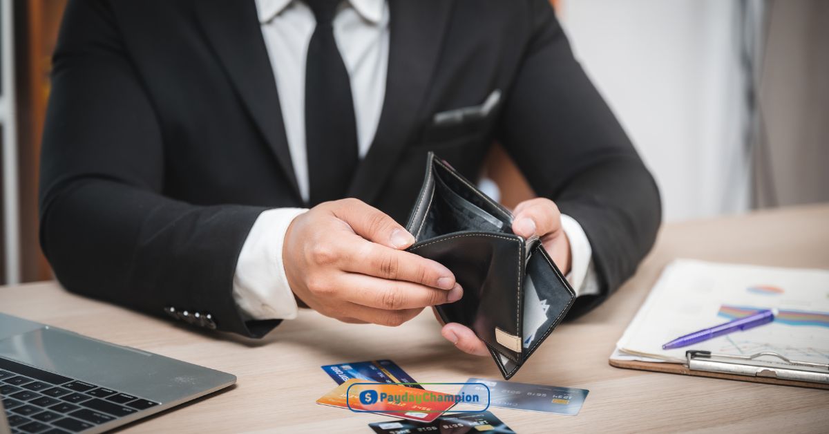 A man in a suit is holding a wallet looking for ways to increase their credit limit and reap the benefits