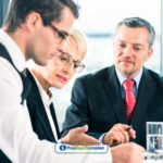 A group of business people sitting around a table for analysing the payment methods of a payday loan