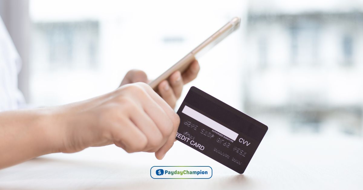 A person holding a smart phone and a credit card comparing credit vs revolving credit