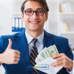 A man in a suit giving a thumb up for the time payday loans get deposited